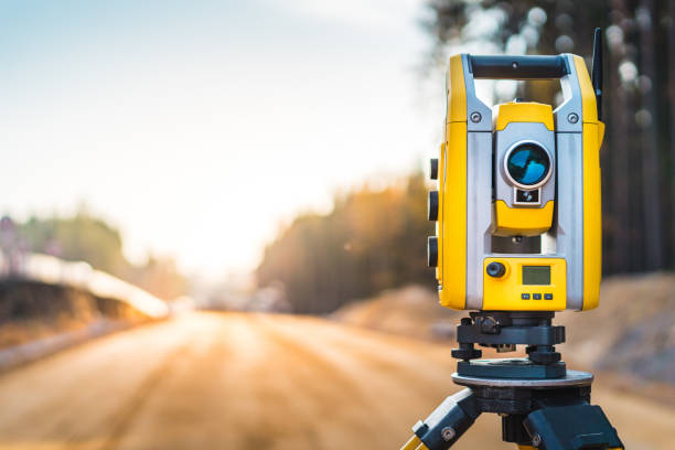 Professional surveying equipment - total station on tripod at construction site
